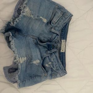 Blue denim size 0 ripped shorts original. Mid-rise